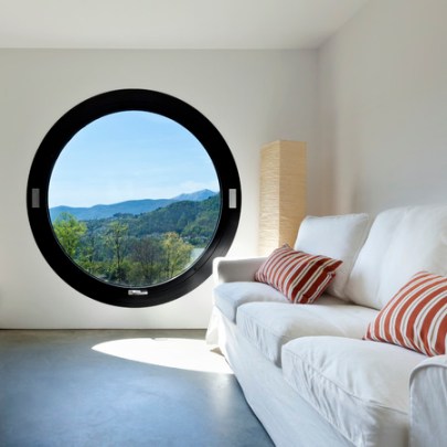 36890860 - beautiful modern house in cement ,room with large porthole